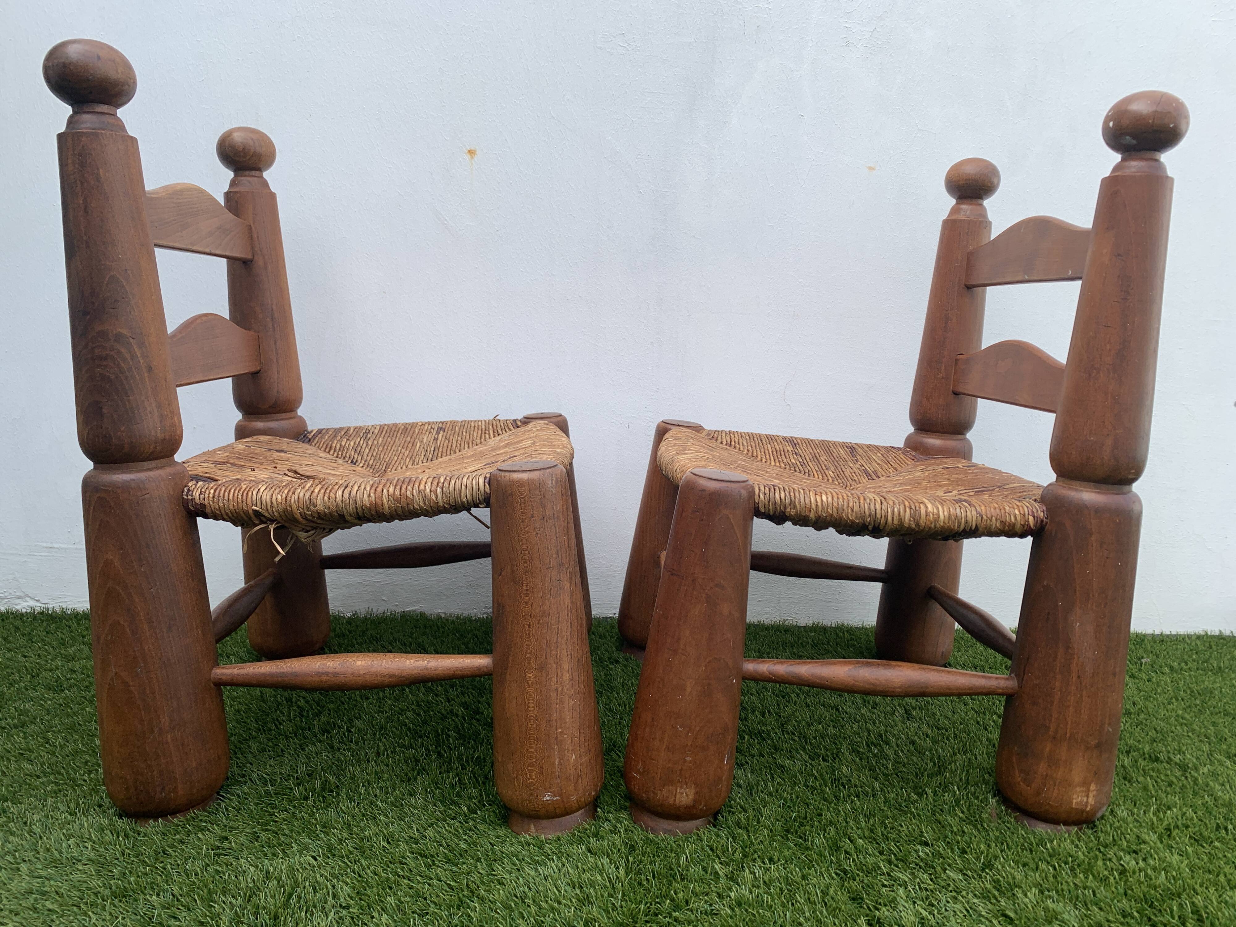 Pair of antique low fire chairs made of wood and straw
