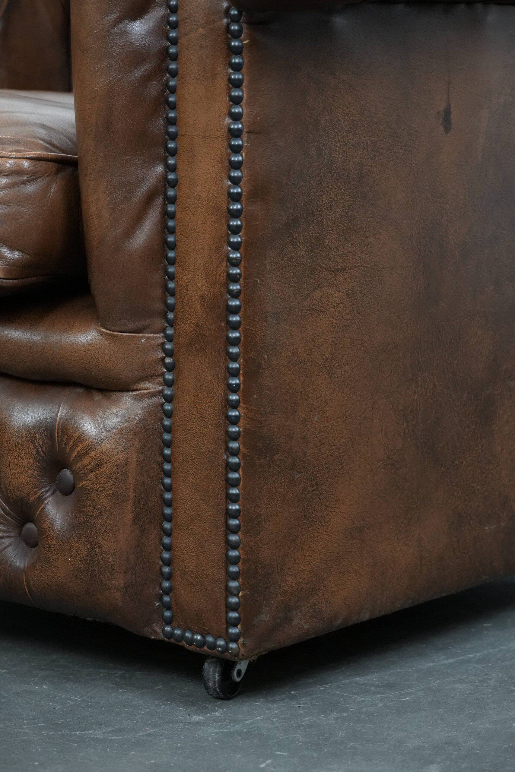 Brown cowhide leather chesterfield armchair  in English style on wheels