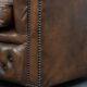 Brown cowhide leather chesterfield armchair  in English style on wheels
