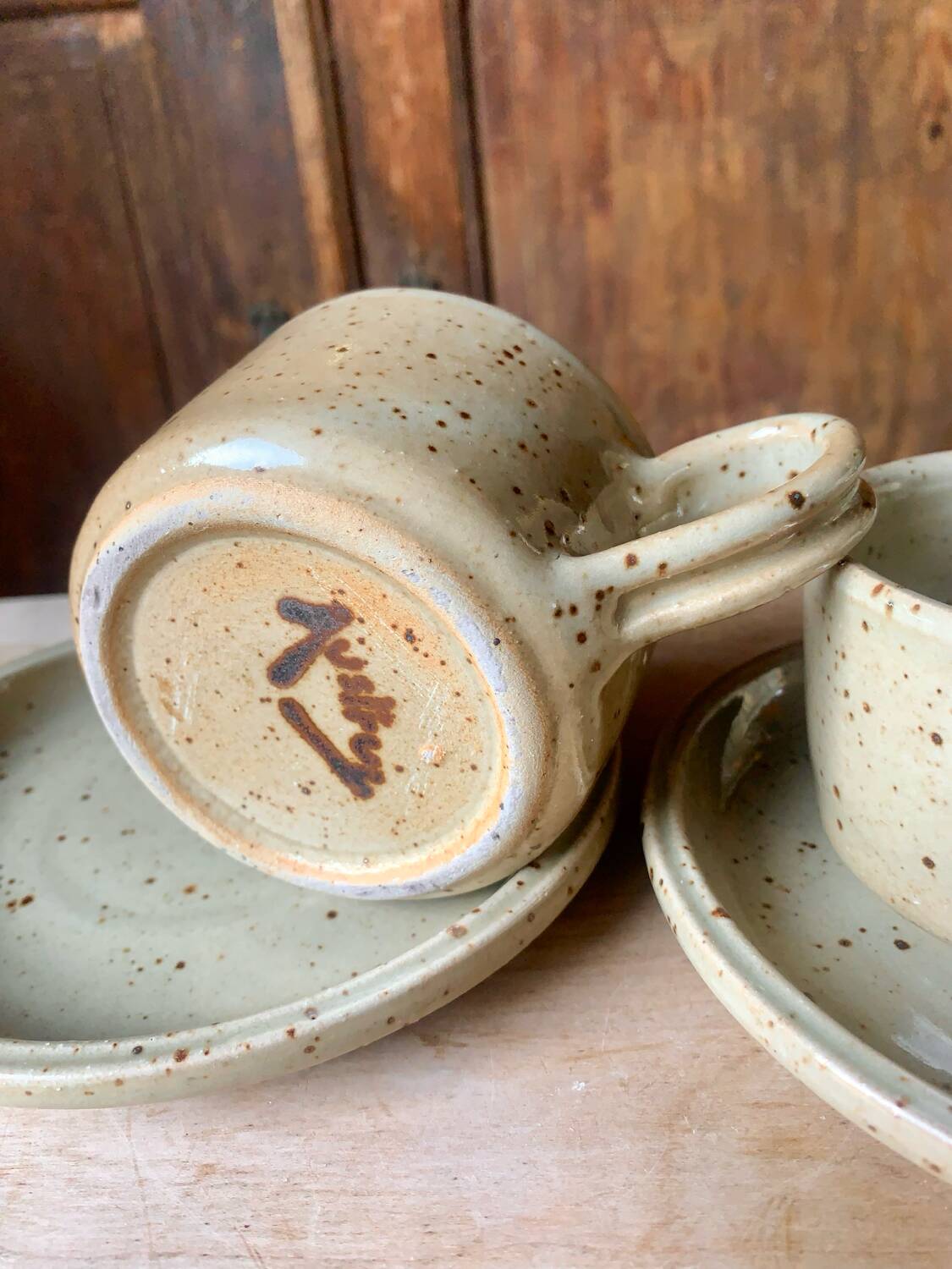 Two large Jean Austruy stoneware cups and saucers