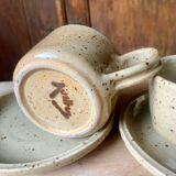 Two large Jean Austruy stoneware cups and saucers