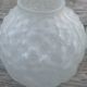 Art Deco ball vase pair with flower and leaf decor