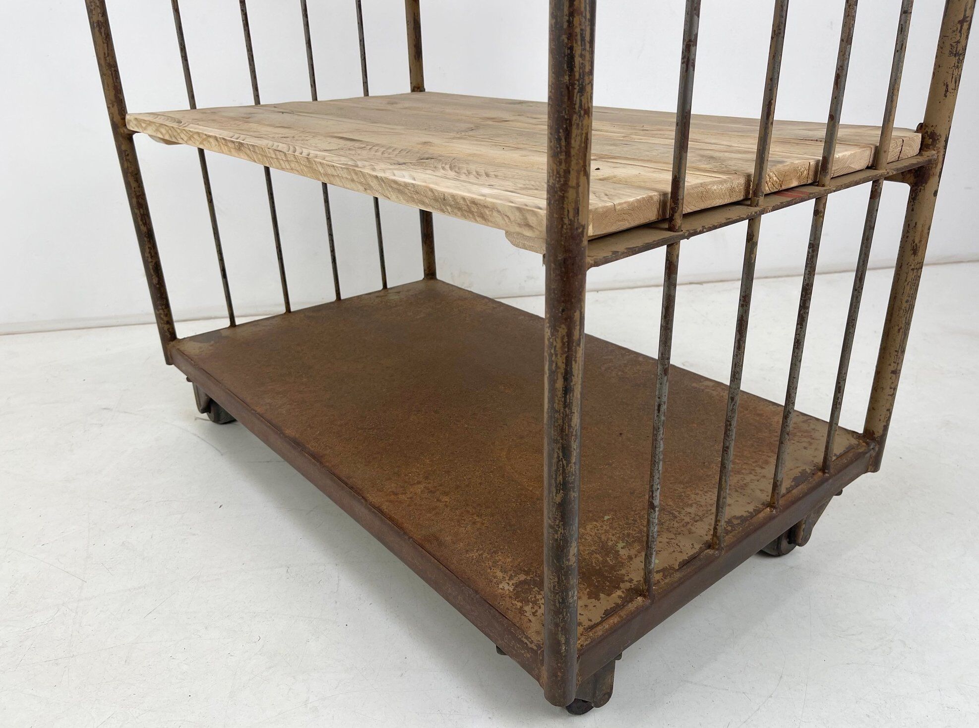 Vintage industrial iron and wood shelves on wheels