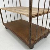 Vintage industrial iron and wood shelves on wheels