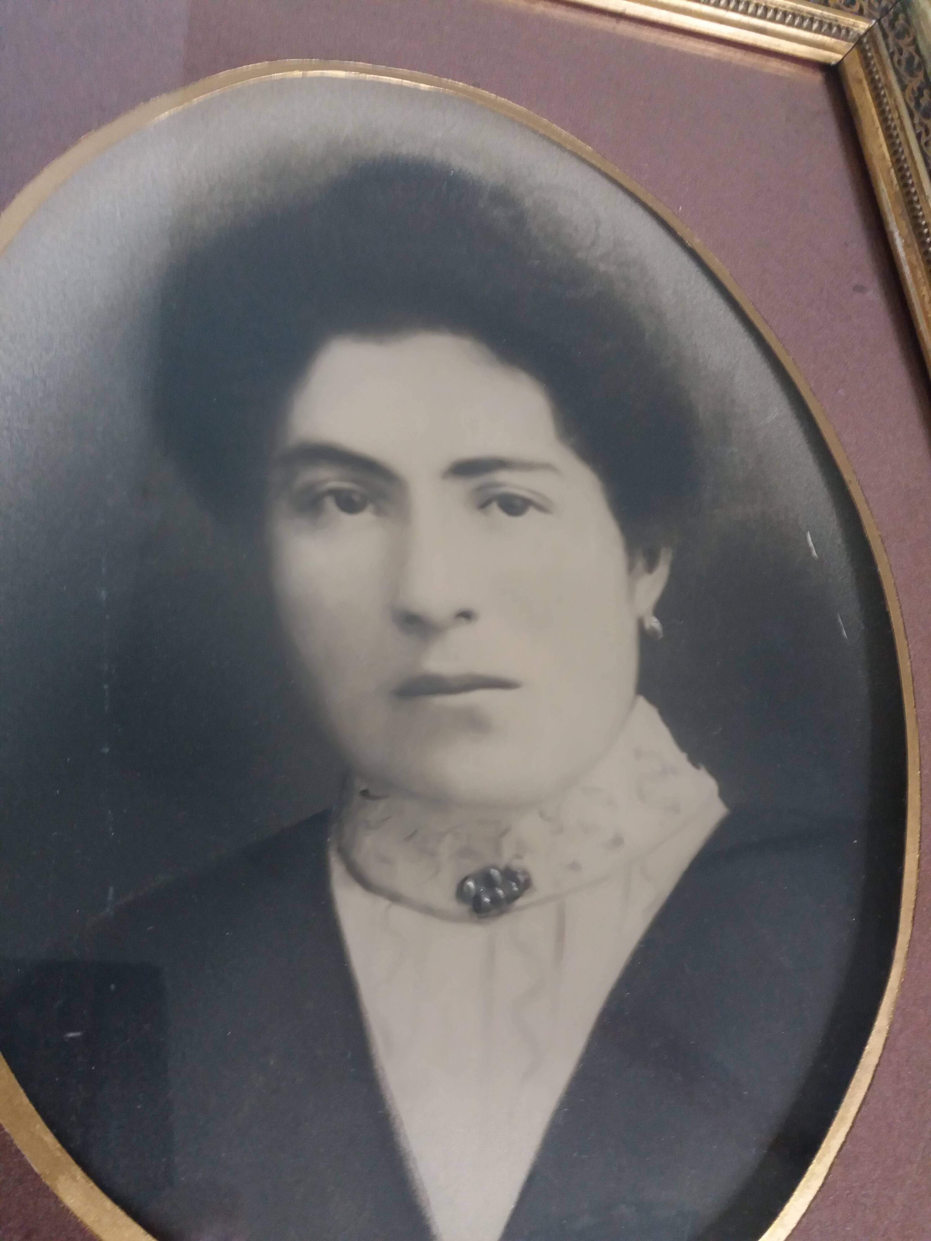 Old photo portrait framed in wood and stucco