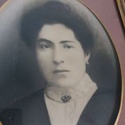 Old photo portrait framed in wood and stucco