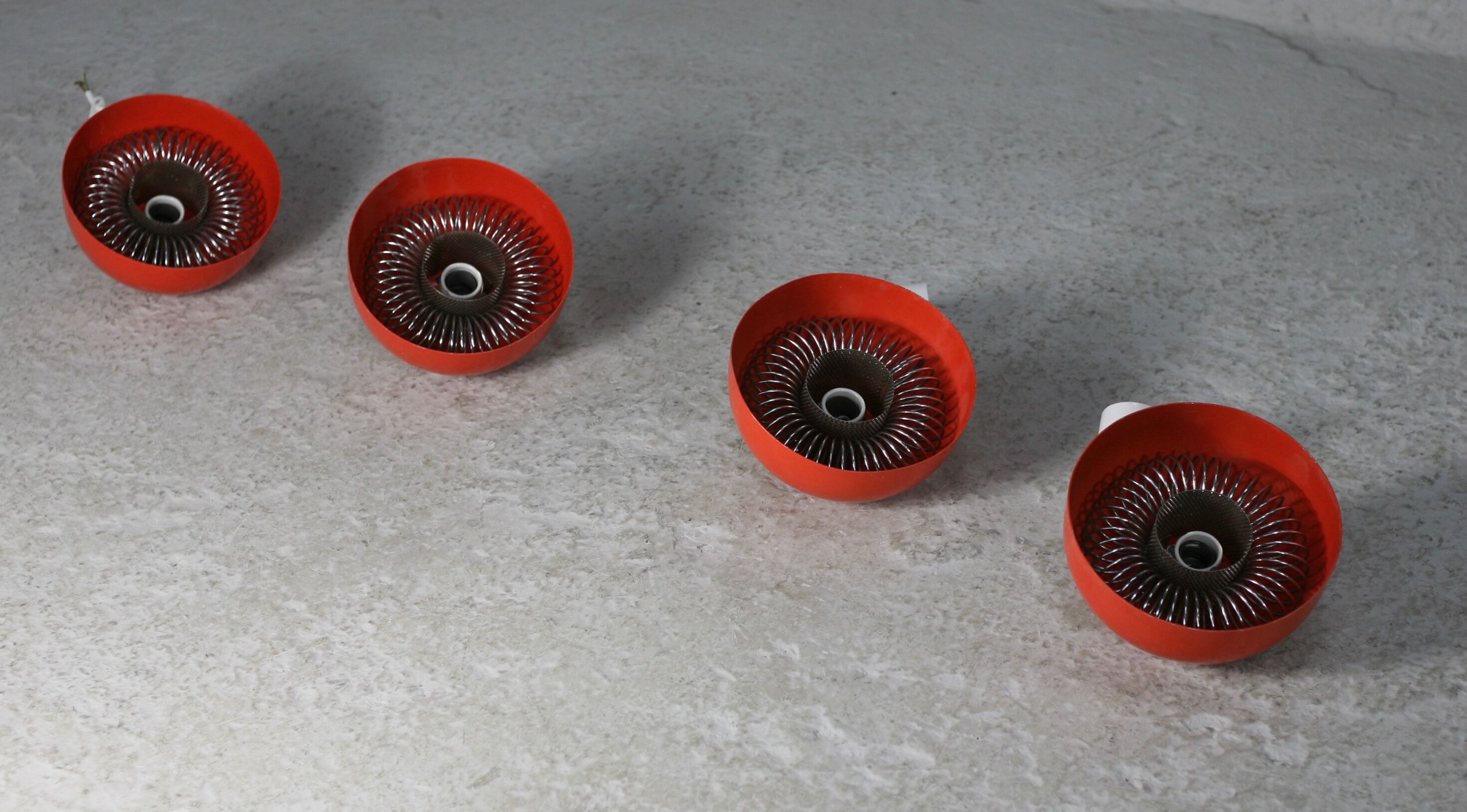 Set of 4 "spring" hanging lamps, orange steel, France, circa 1970