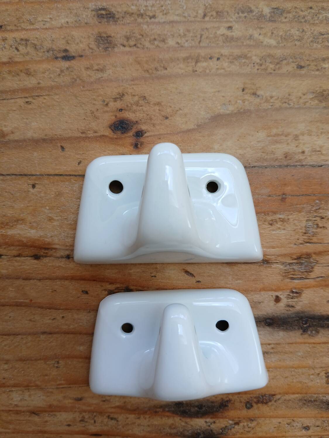 Set of two porcelain tea towel holders