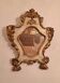 18th-century Italian mirror in gilded and painted wood.