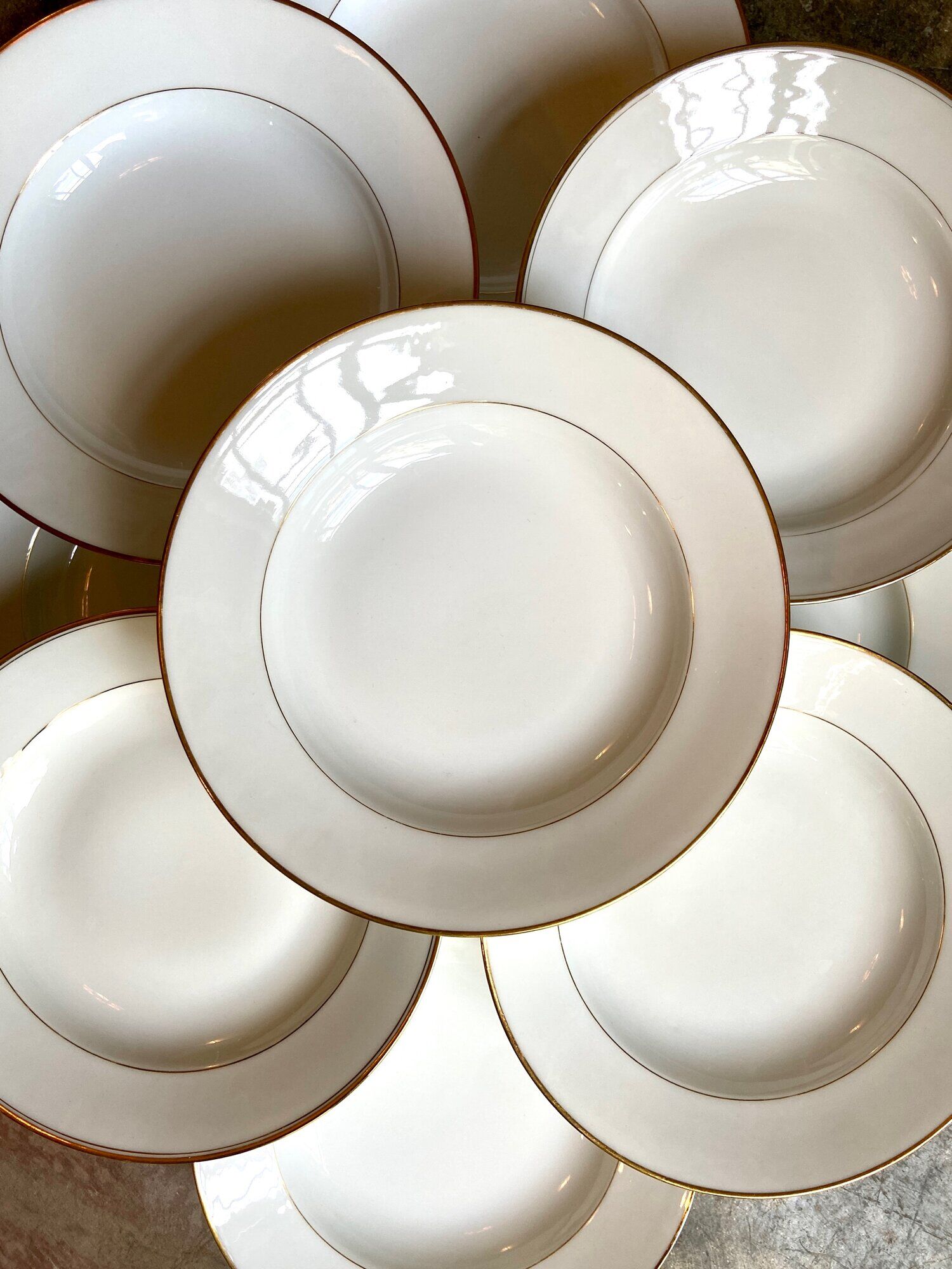 9 hollow plates in white and golden Limoges porcelain