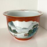 Chinese planter or Chinese porcelain pot cover decorated with landscapes on a coral and golden background