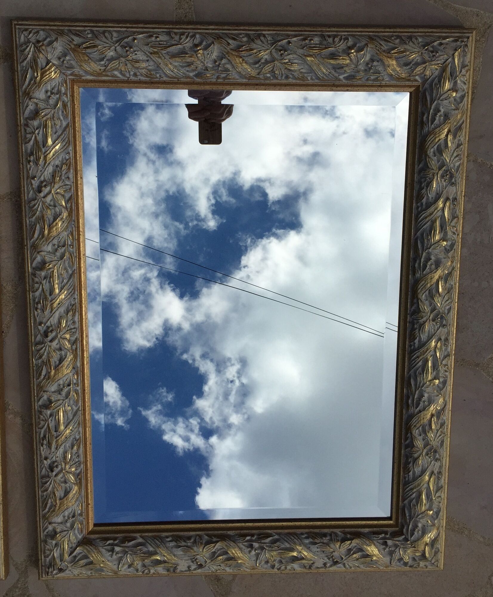 Pair of bevelled mirrors in white and gilded wood 86 x 66 cm