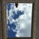 Pair of bevelled mirrors in white and gilded wood 86 x 66 cm