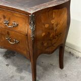 Curved and inlaid Louis XV style chest of drawers