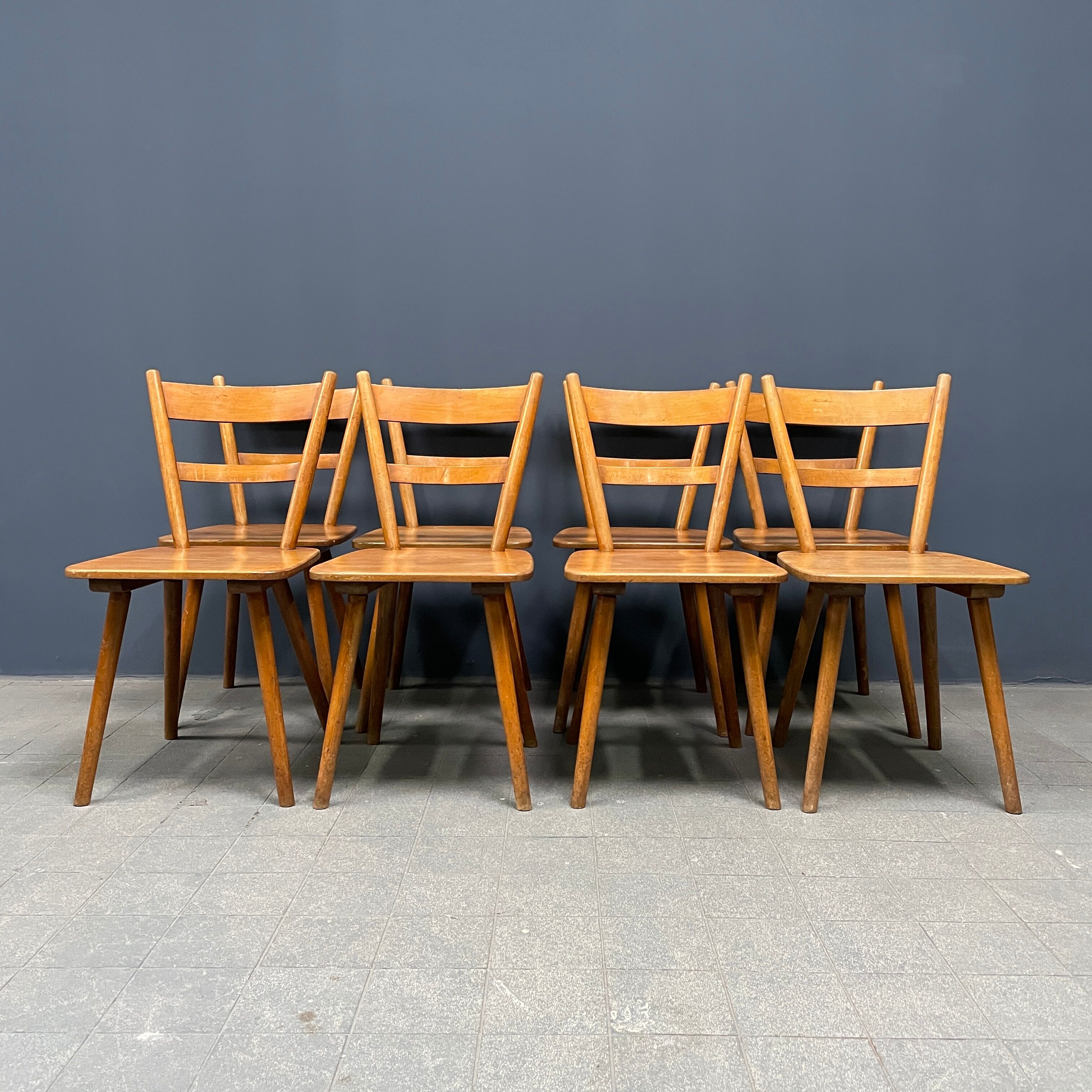 Set of eight german stick chairs from the 1950