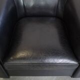 Very comfortable black Art Deco design armchair, made of sheepskin leather