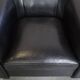 Very comfortable black Art Deco design armchair, made of sheepskin leather