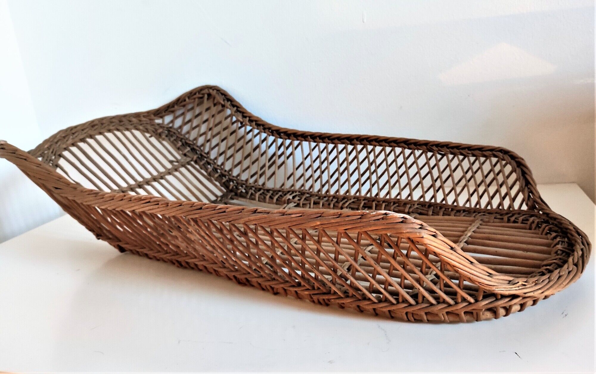 Rattan wicker woven bamboo bassinet or vintage bread pan