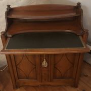 Vintage drop-leaf secretary with a green leather top and inlays.