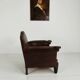 Antique leather club chair with stud detailing