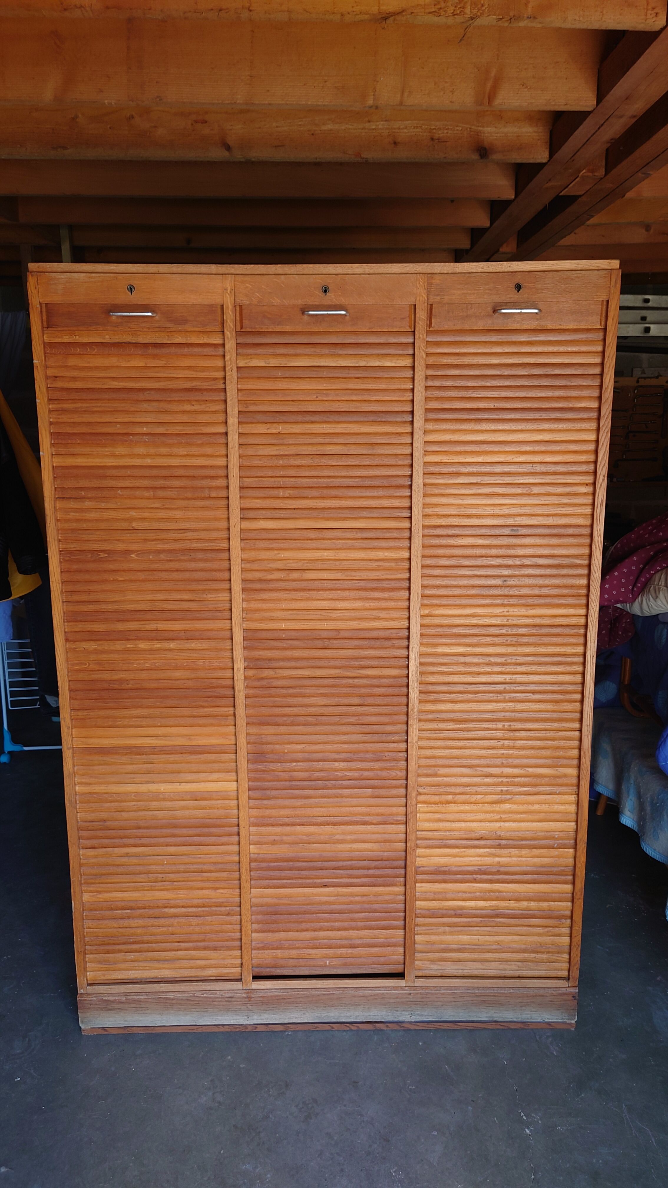 Filing cabinet has curtains, notary furniture. 3 columns