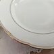 Set of 6 deep plates in fine porcelain from Bohemia with a gold rim.