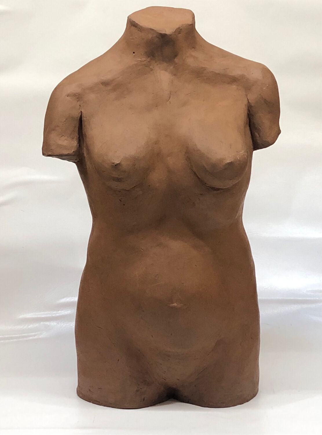 School bust of a female body in red clay terracotta