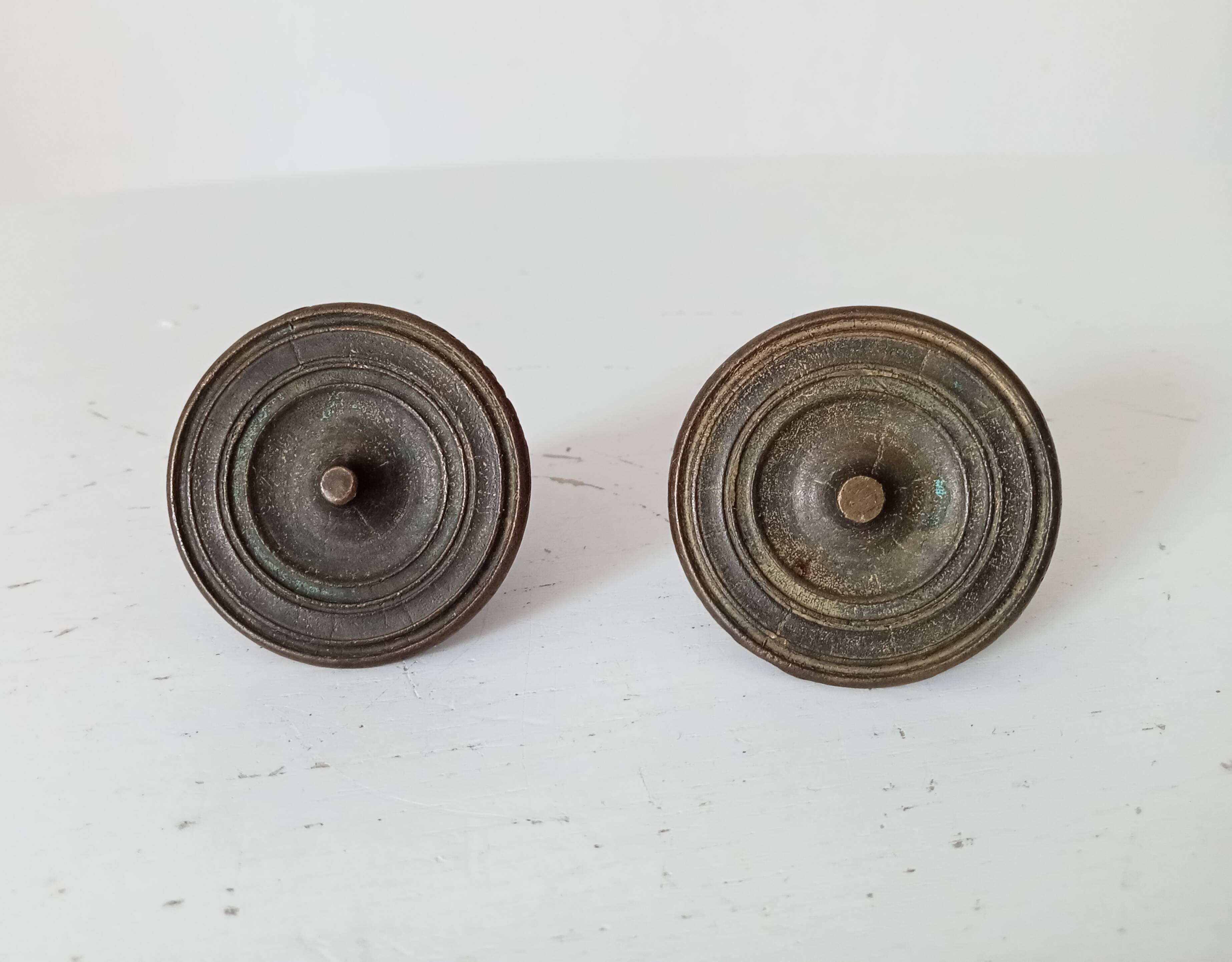 Pair of antique Empire furniture knobs from the 19th century.