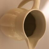 Cream color earthenware pitcher