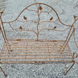 Wrought iron garden bench with birds