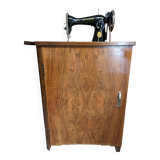 Singer sewing machine in its cabinet