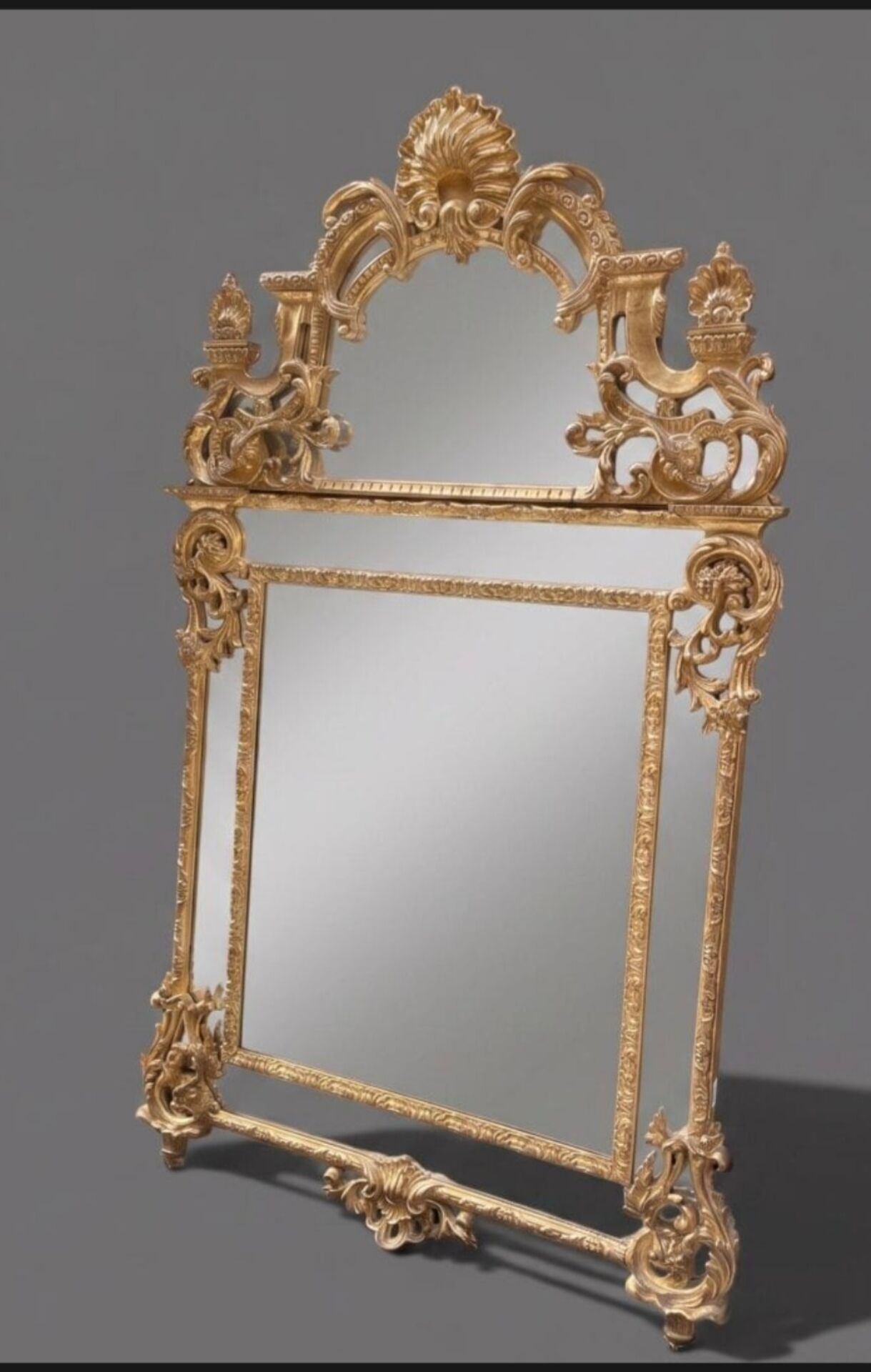 Regency style mirror in gilded wood, first half of the 19th century.