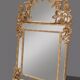 Regency style mirror in gilded wood, first half of the 19th century.