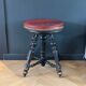 Tabouret de piano en cuir capitonnée et bois noirci