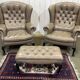 Pair of high-backed Chesterfield armchairs with 1 leather footrest