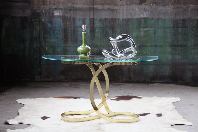Brass ribbon console table Design Institute of America