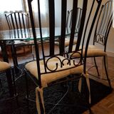 Elegant round table with 6 bronze and wrought iron chairs