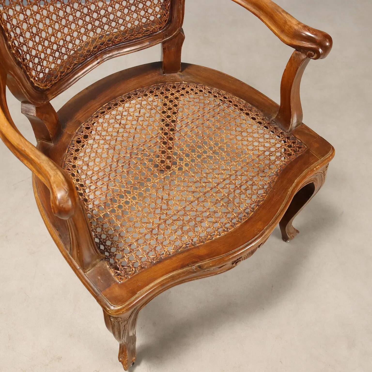 Antique baroque-style armchairs in walnut and fabric, 19th century.