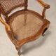 Antique baroque-style armchairs in walnut and fabric, 19th century.