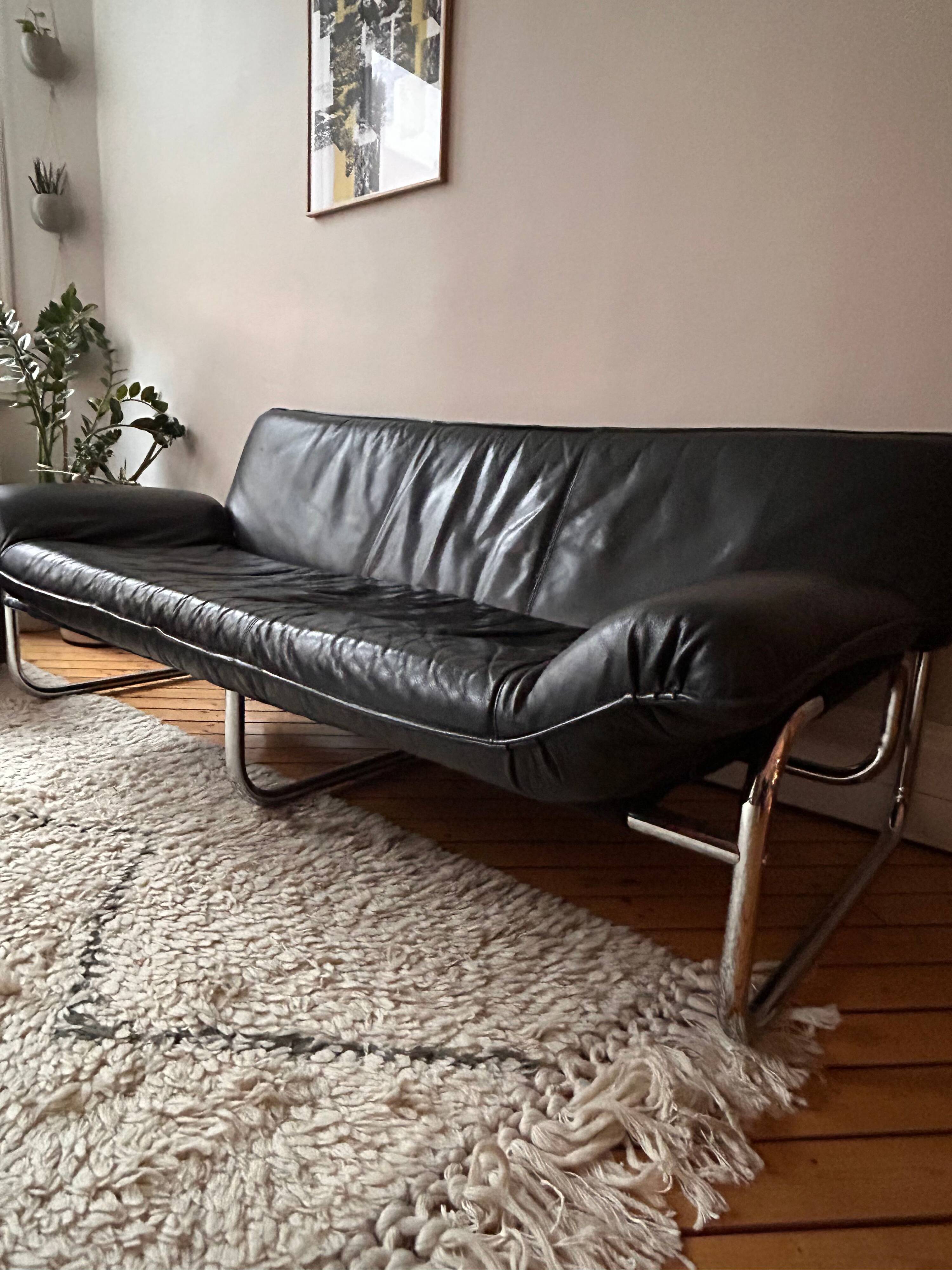 Black leather sofa designed by Johan Bertil Häggström