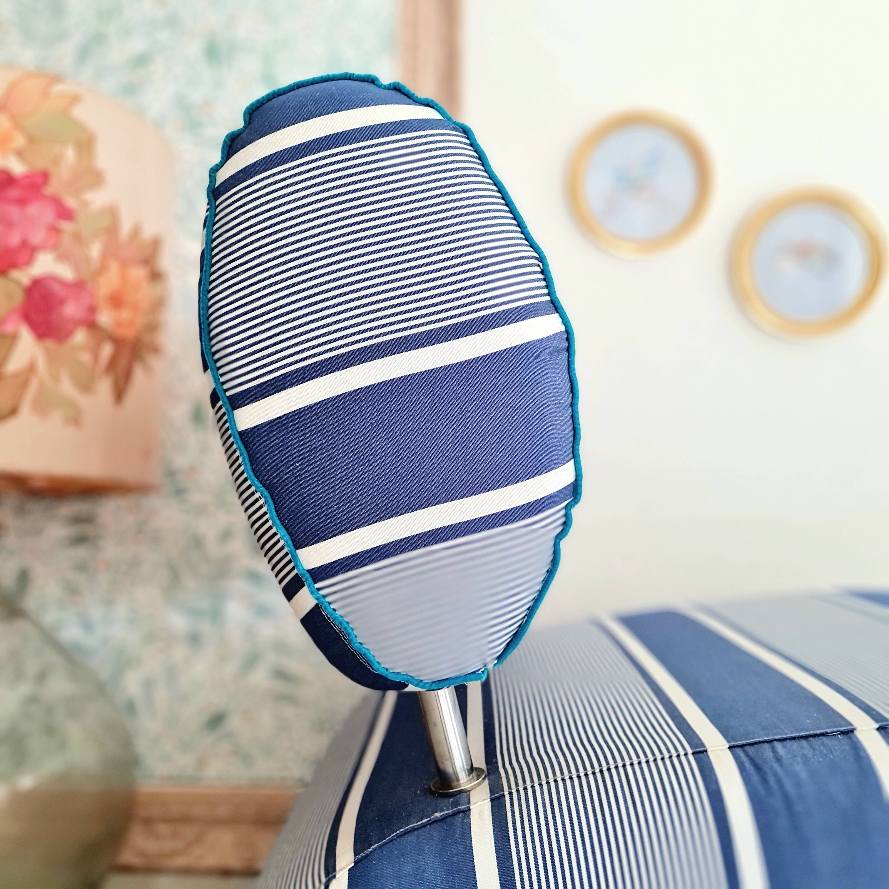 Curved armchair with blue and white stripes