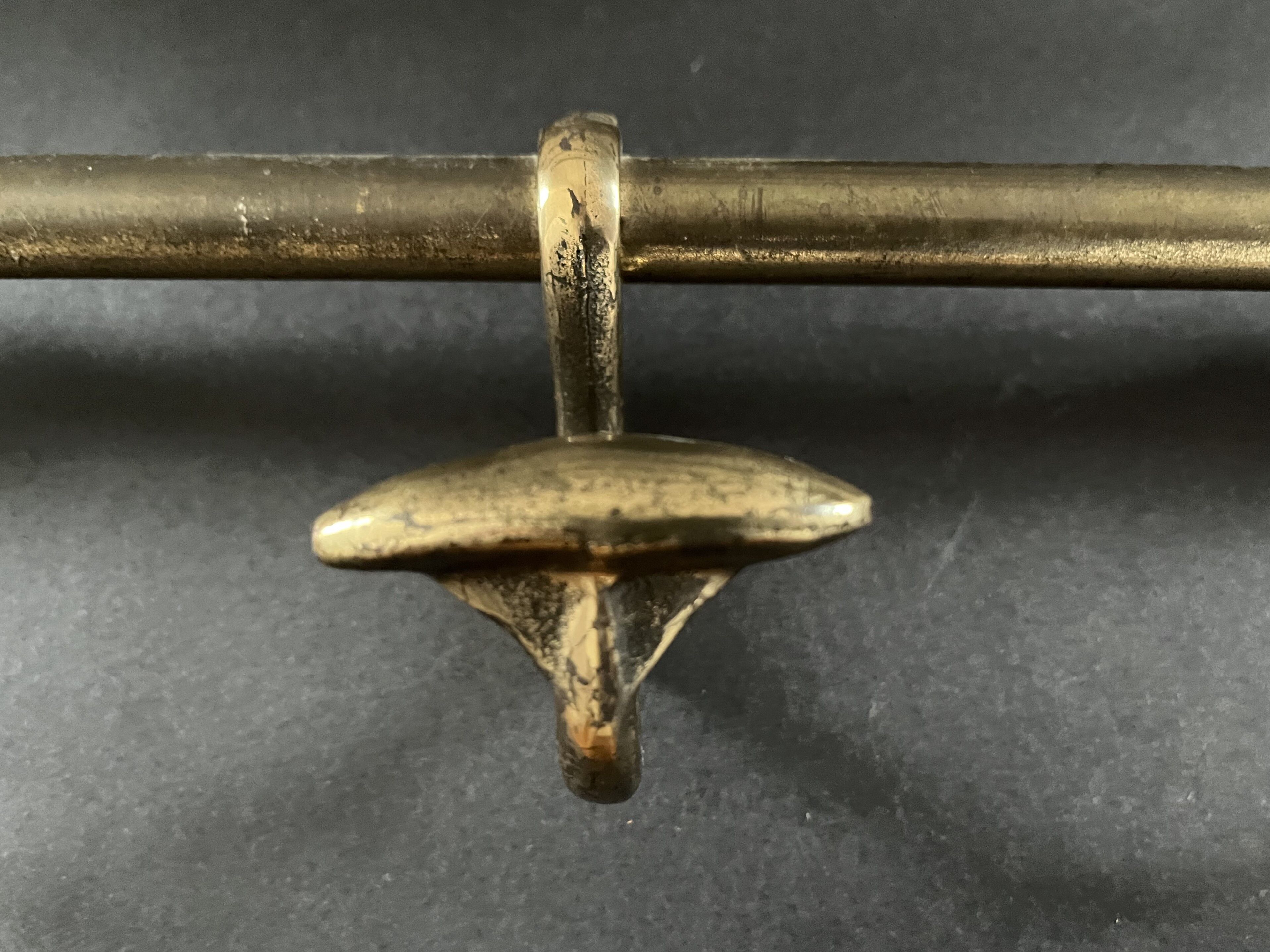 Antique coat rack in gilded metal