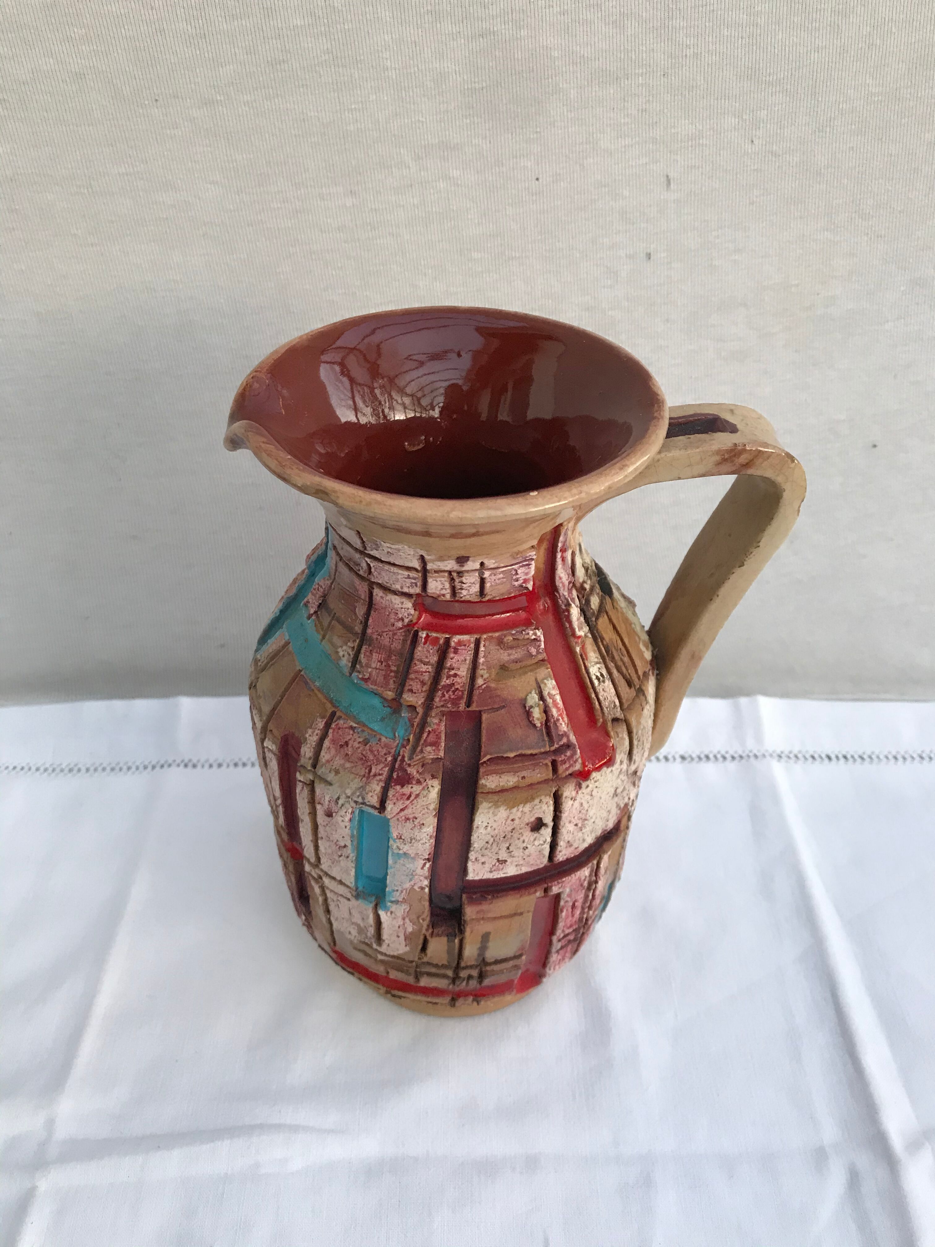 Former beige ceramic pitcher