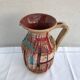 Former beige ceramic pitcher