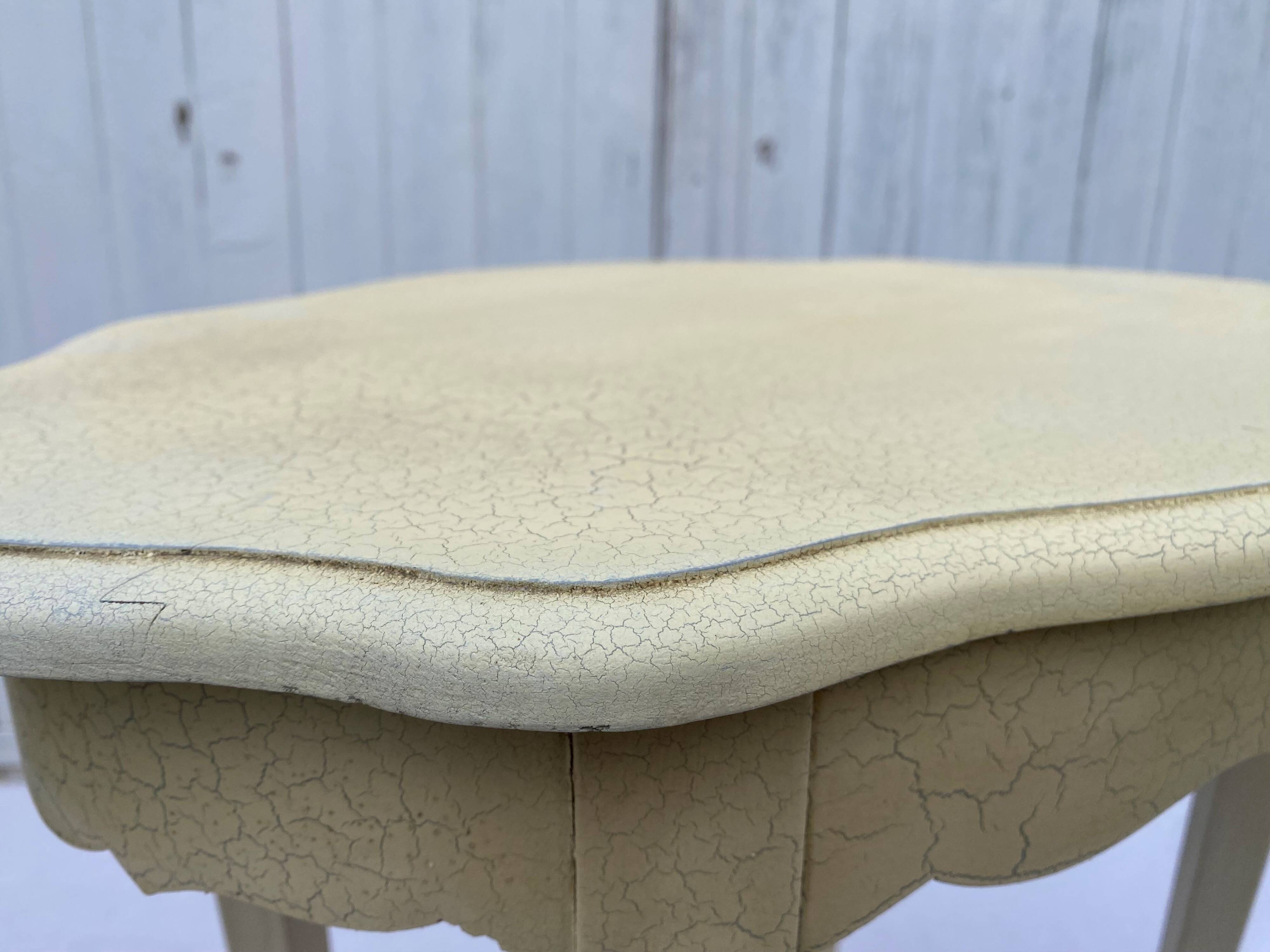 Eggshell-coloured drawer with a cracked effect side table.