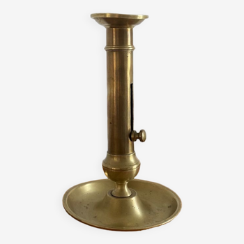 Antique brass push candle holder