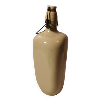 Old vintage triangular stoneware bottle