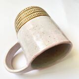 Handmade golden ceramic mug