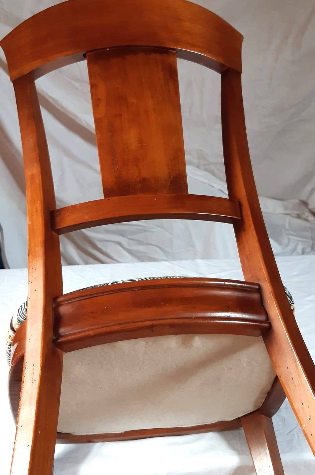 2 varnished solid wood chairs with "ethnic" padding