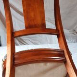2 varnished solid wood chairs with "ethnic" padding